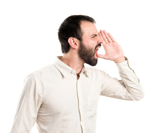 Young man screaming over white background — Stock Photo, Image