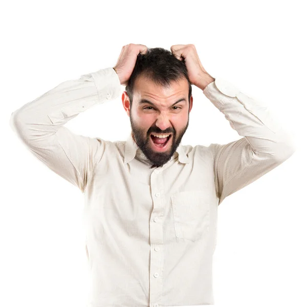 Young man furious over white background — Stock Photo, Image