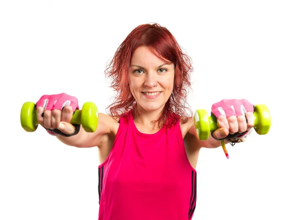 Young girl doing weightlifting over white background — Stock Photo, Image