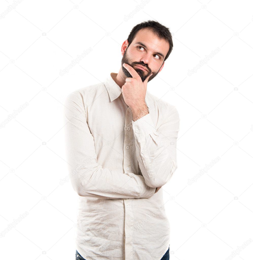 Young man thinking over white background