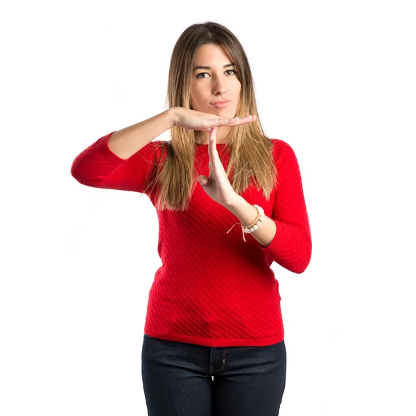 Young girl making time out gesture over white background — Stock Photo, Image