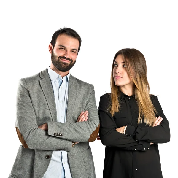 Couple with their arms crossed over isolated background — Stock Photo, Image