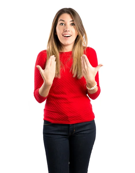 Chica joven sorprendida sobre fondo blanco —  Fotos de Stock