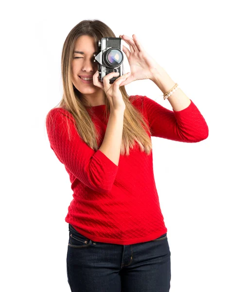 Girl taking a picture over white background — Stock Photo, Image