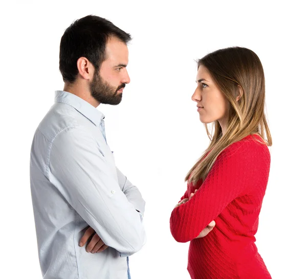 Couple with their arms crossed over isolated background — Stock Photo, Image