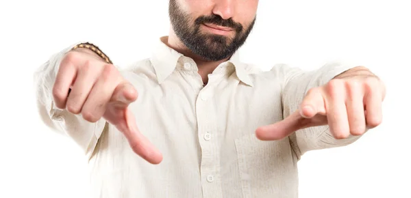 Young man pointing opposite over white background — Stock Photo, Image