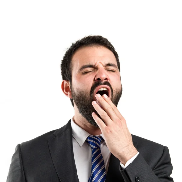 Empresario bostezando sobre fondo blanco — Foto de Stock
