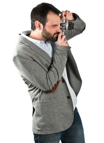 Man photographing over white background — Stock Photo, Image