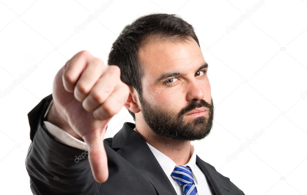 Businessman pointing to the side over white background
