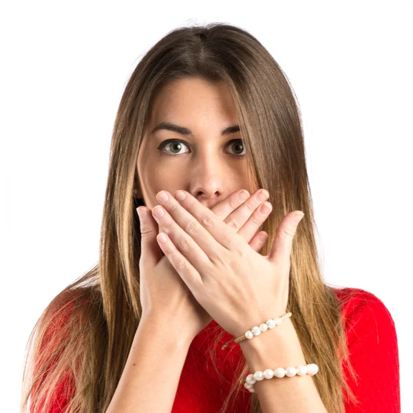 Pretty young girl with her mouth closed by her hands — Stock Photo, Image