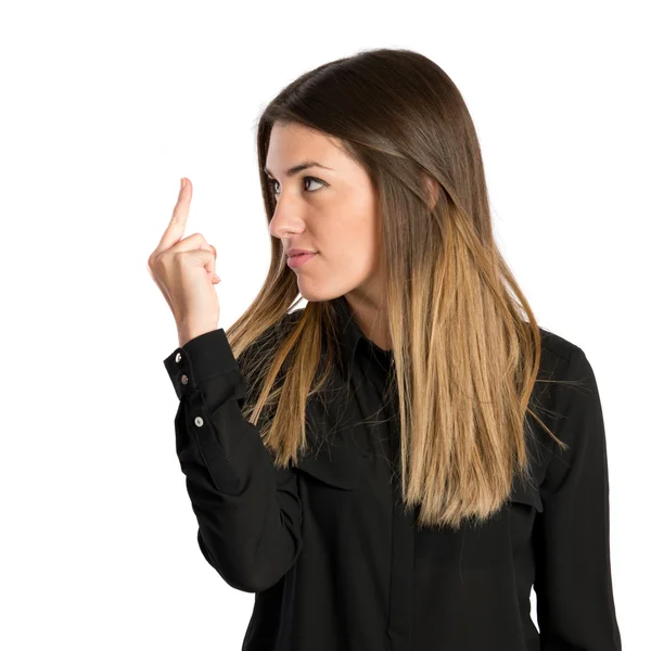 Jovem menina fazendo chifre gesto sobre fundo branco — Fotografia de Stock