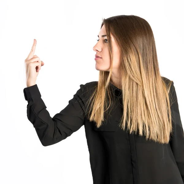 Ung flicka gör horn gest över vit bakgrund — Stockfoto