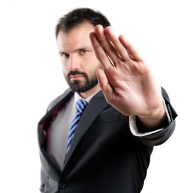 genç işadamı beyaz arka plan üzerinde dur işareti yapıyor