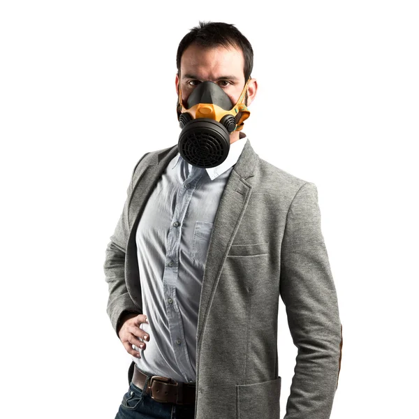 Jonge zakenman met gas masker op witte achtergrond — Stockfoto