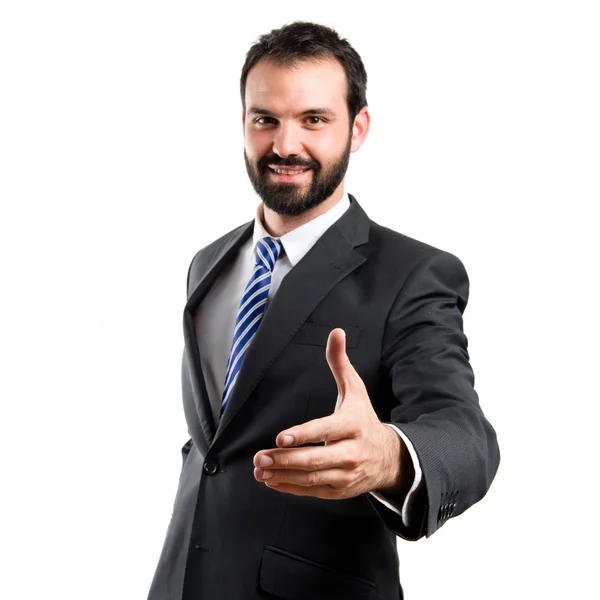 Hombre de negocios haciendo un trato sobre fondo blanco aislado — Foto de Stock