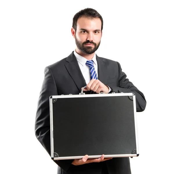 Young businessman with his briefcase over white background — Stock Photo, Image