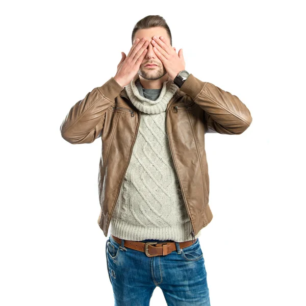 Men covering his eyes over white background — Stock Photo, Image
