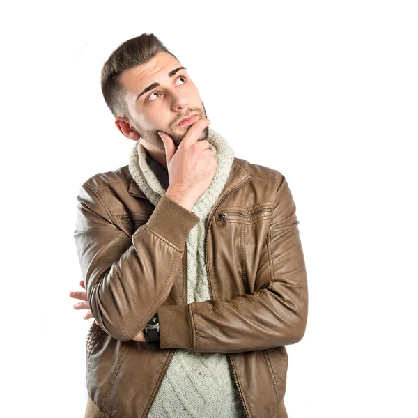 Young man thinking over white background — Stock Photo, Image