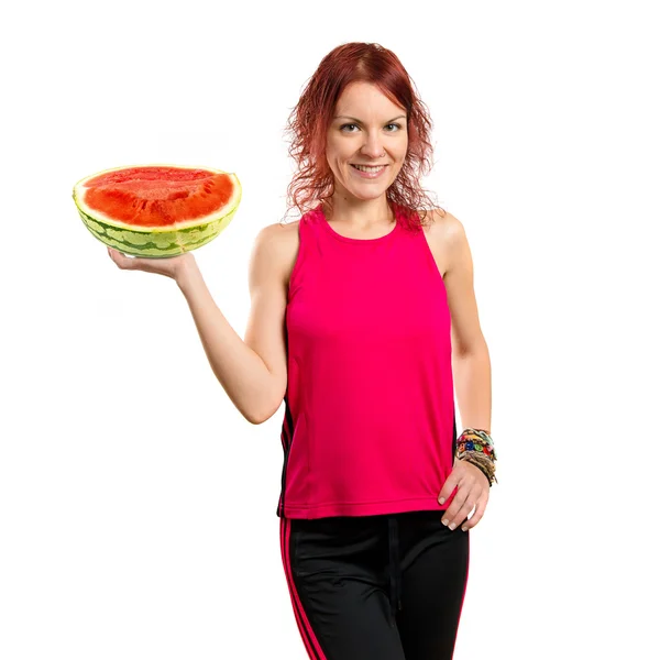 Ung flicka anläggning vattenmelon. — Stockfoto