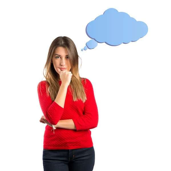 Cute young girl thinking an idea over isolated white background — Stock Photo, Image