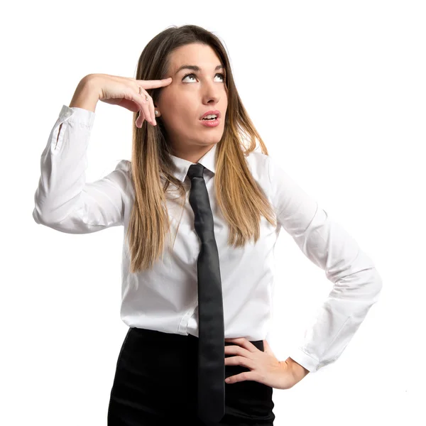 Businesswoman making a crazy gesture over white background — Stock Photo, Image