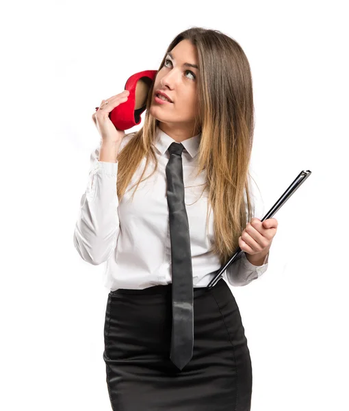 Girl talking to shoe over isolated background. — Stock Photo, Image