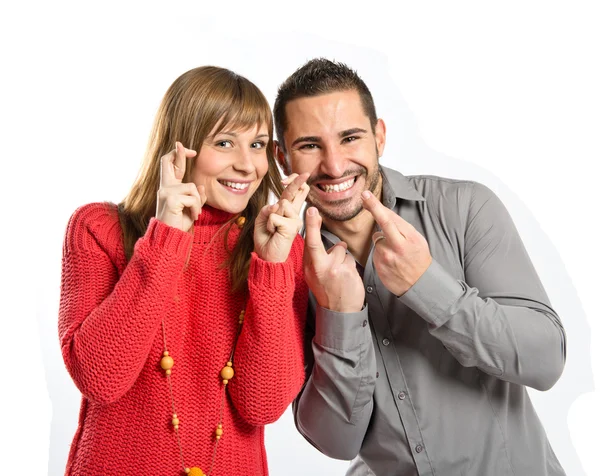 Couple avec les doigts croisés sur fond blanc — Photo