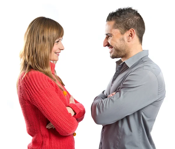 Couple with their arms crossed over isolated background — Stock Photo, Image