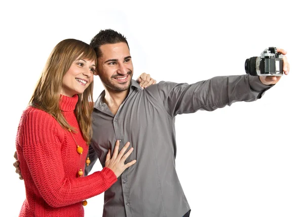 Uomo fotografare con la sua ragazza su sfondo bianco — Foto Stock