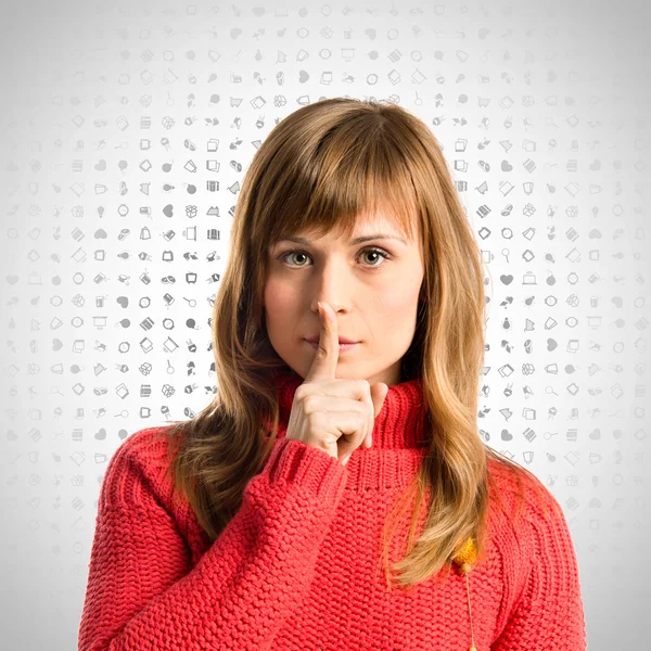 Young girl making silence gesture over background with icons — Stock Photo, Image