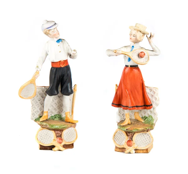 Muñecas de porcelana jugando al tenis sobre fondo blanco —  Fotos de Stock