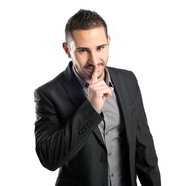 Young man making silence gesture over isolated white background — Stock Photo, Image