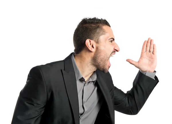 Young man screaming over isolated white background — Stock Photo, Image