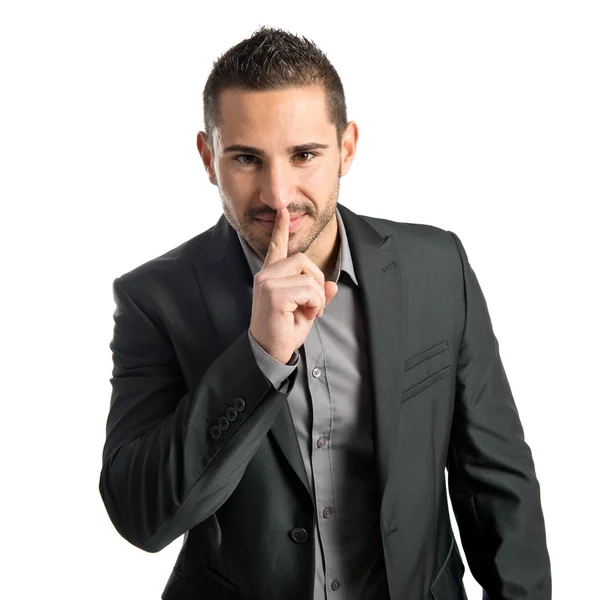 Jonge man maken stilte gebaar over geïsoleerde witte achtergrond — Stockfoto