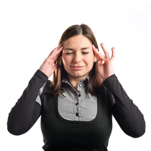 Leuk meisje met hoofdpijn over geïsoleerde witte achtergrond — Stockfoto