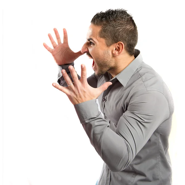 Joven gritando sobre fondo blanco aislado —  Fotos de Stock