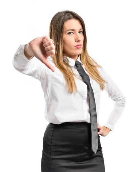 Menina fazendo um mau sinal sobre fundo branco — Fotografia de Stock