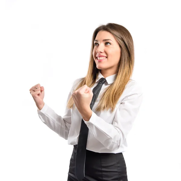 Young businesswoman winning over white background — Stock Photo, Image