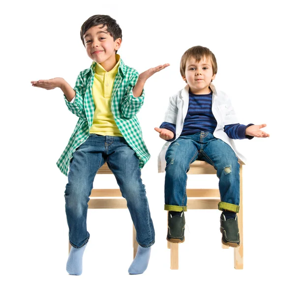 Kids with doubts over white background — Stock Photo, Image