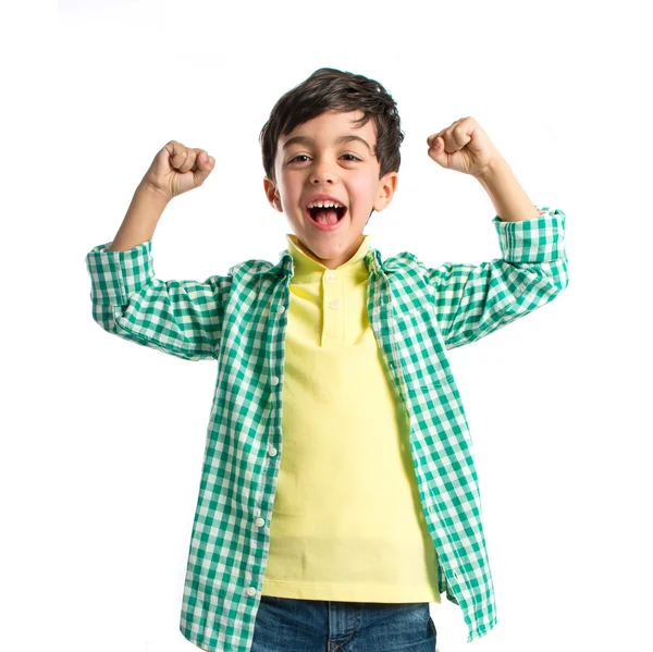 Lucky brunette kid over isolated white background — Stock Photo, Image