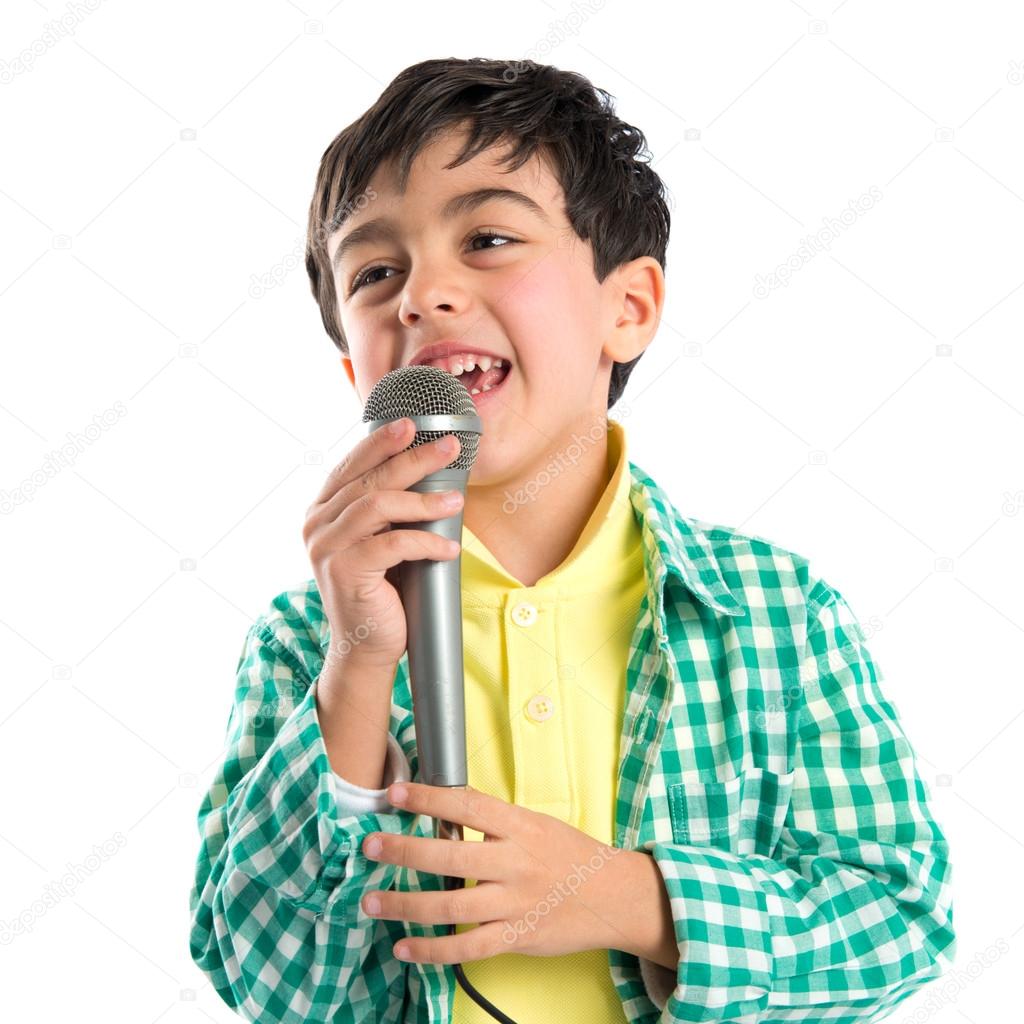 Kid singing over white background 