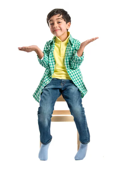 Kid with doubts over white background — Stock Photo, Image