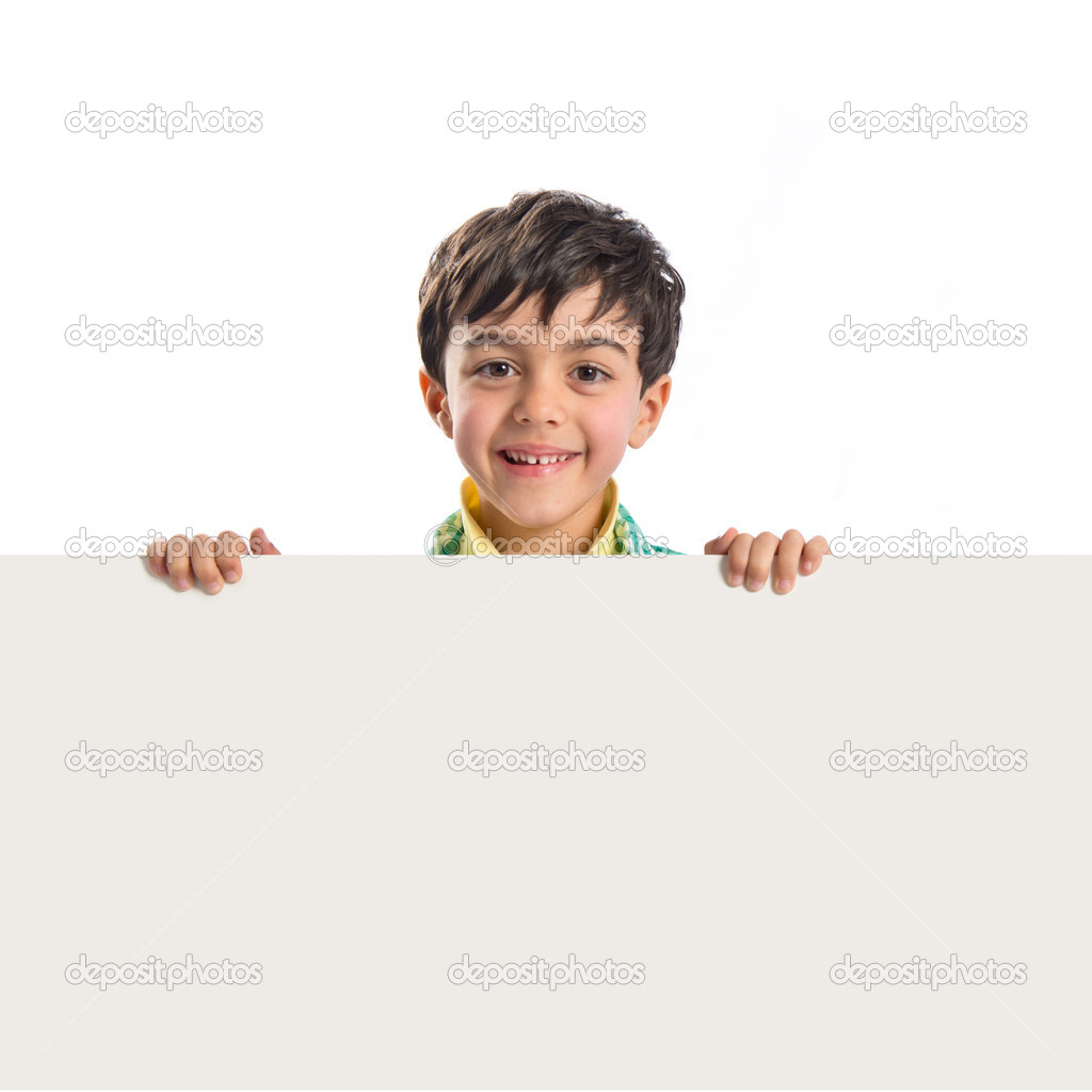 Kid holding empty placard over white background 