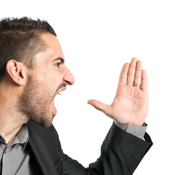 Young man screaming over isolated white background — Stock Photo, Image