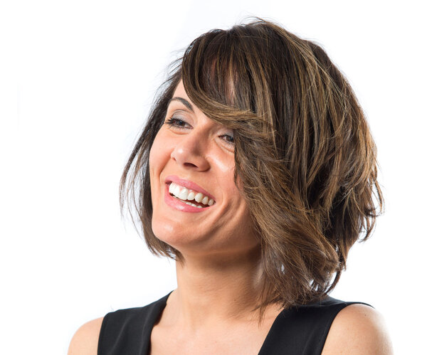 Pretty brunette woman with black dress over white background 