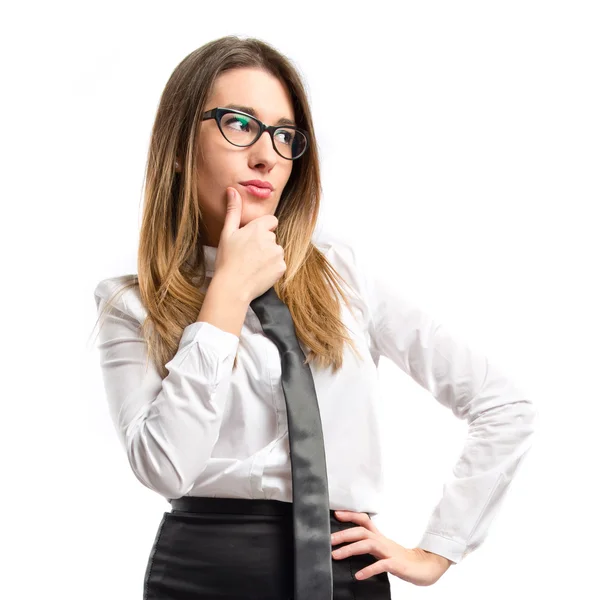 Cute businesswoman thinking an idea over isolated white background — Stock Photo, Image