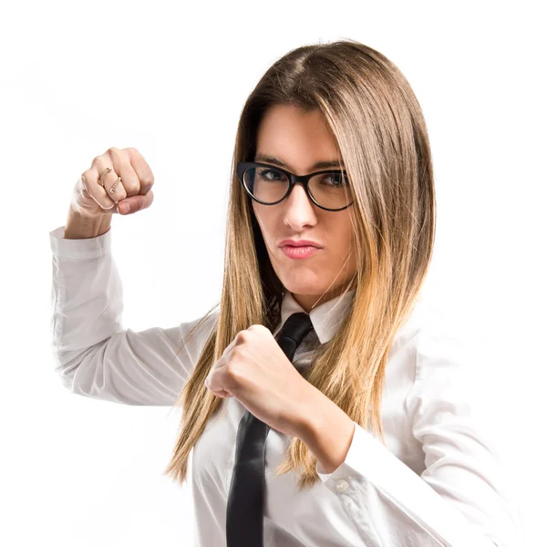 Young businesswoman giving punch over isolated white background — Stock Photo, Image