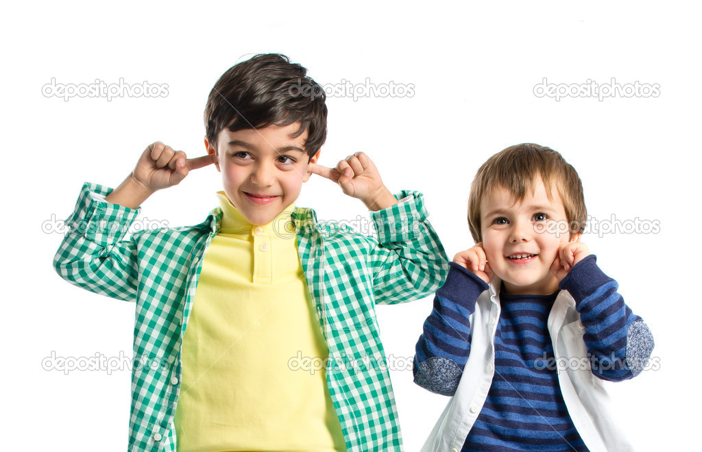 Boys covering his ears over white background. 