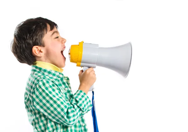 Criança gritando por megafone sobre fundo branco — Fotografia de Stock