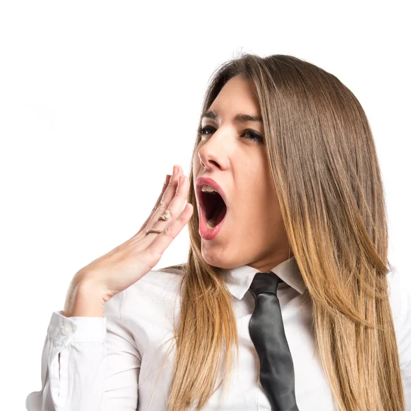 Young girl yawning over isolated white background — Stock Photo, Image